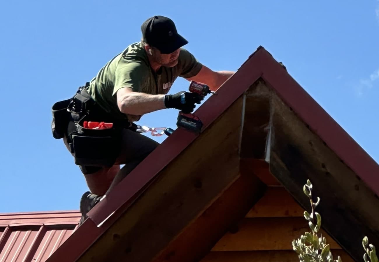 Florida Wildlife Specialists technician installing roofline exclusion to prevent wildlife entry